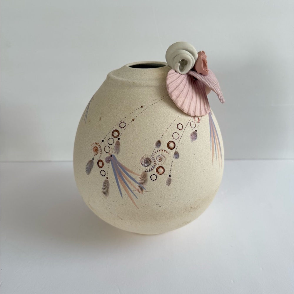 Elegant Cream Ceramic Vase with Artistic Accents